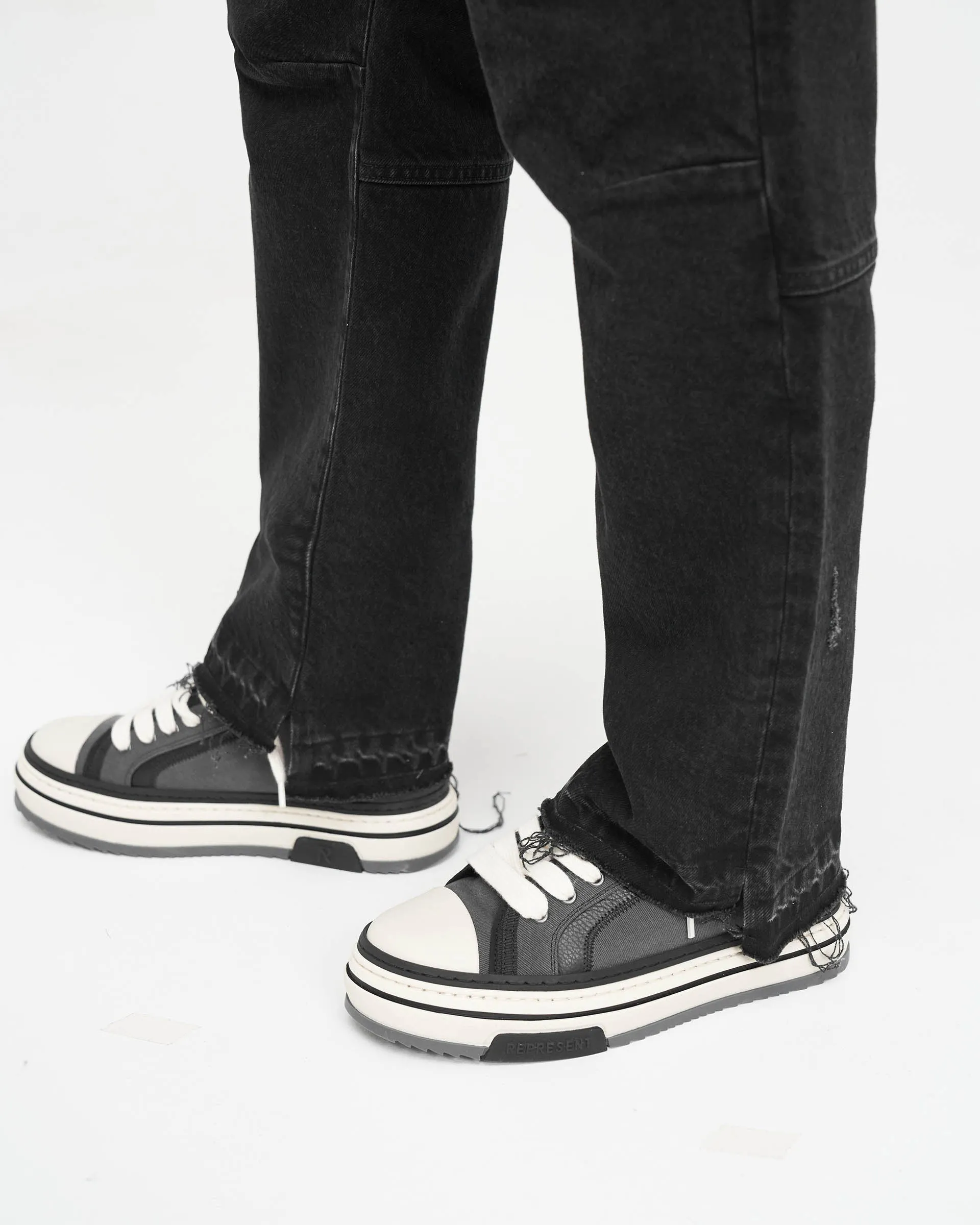 Off Black R2 Stepped Hem Denim: Modernized Classic Jeans for a Contemporary Look