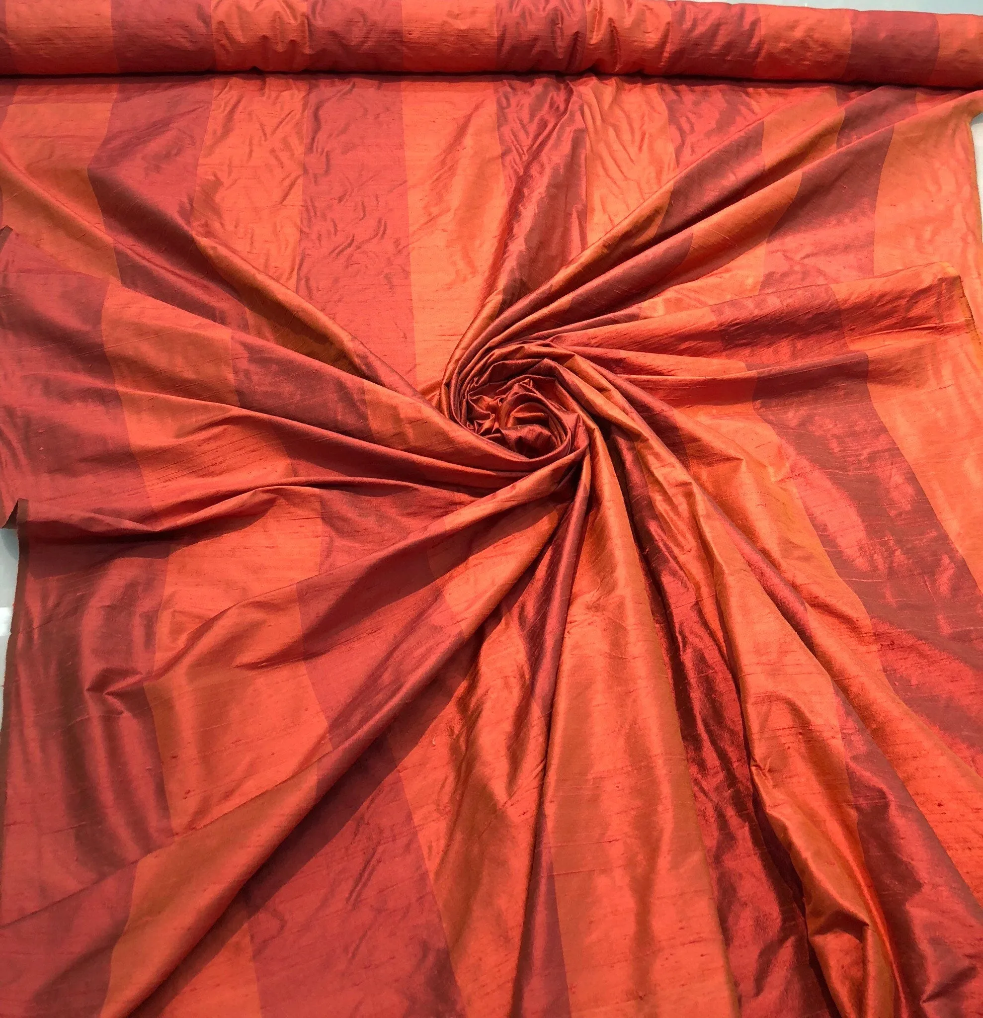 Silk shantung stripe 54&quot; wide    Beautiful burnt orange color stripe silk shantung fabric sold by the yard
